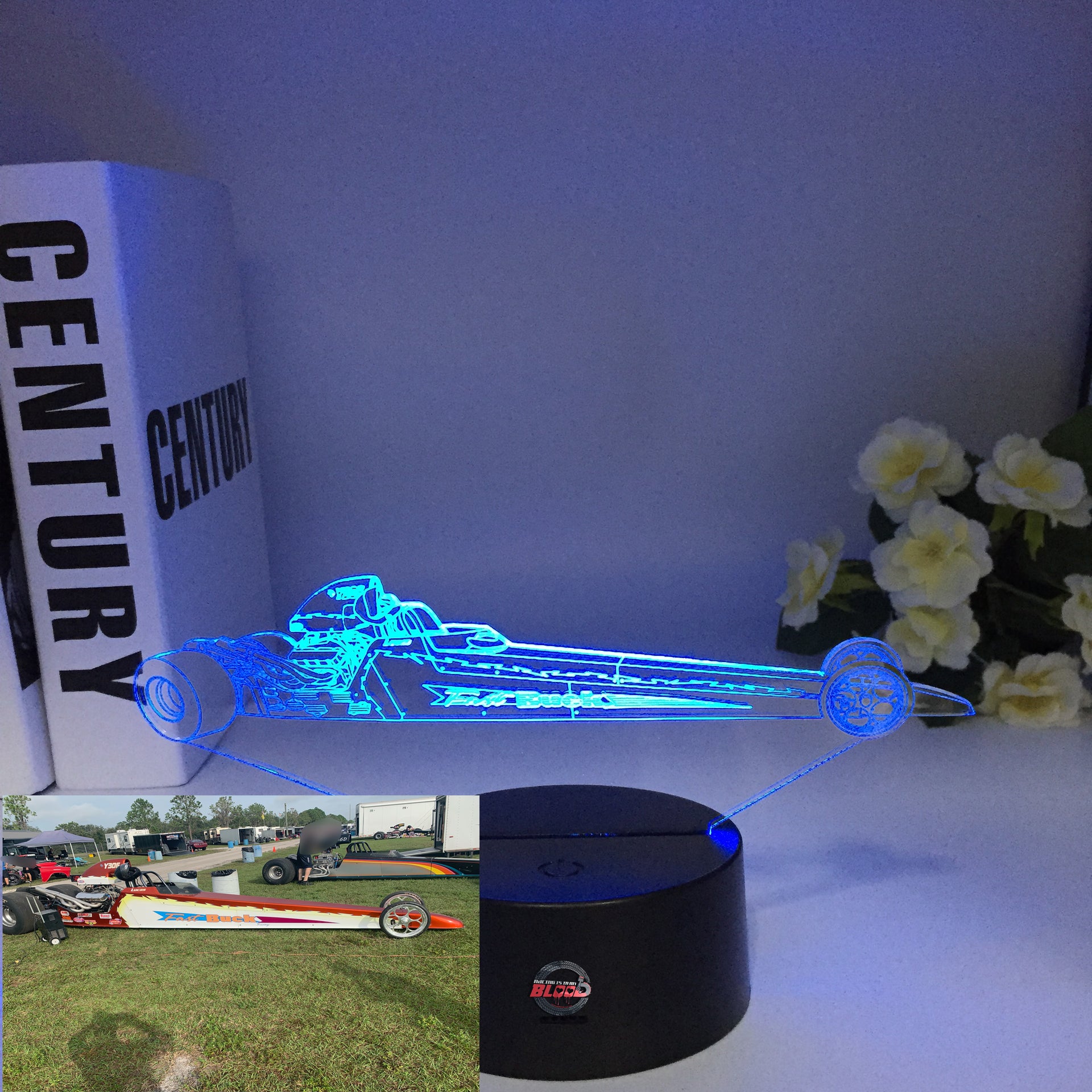 A personalized 3D LED Illusion Lamp featuring a custom-etched dragster design based on a user-provided photo, glowing in a vibrant blue on a black base.