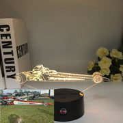 A personalized 3D LED Illusion Lamp featuring a custom-etched dragster design based on a user-provided photo, glowing in a vibrant blue on a black base.