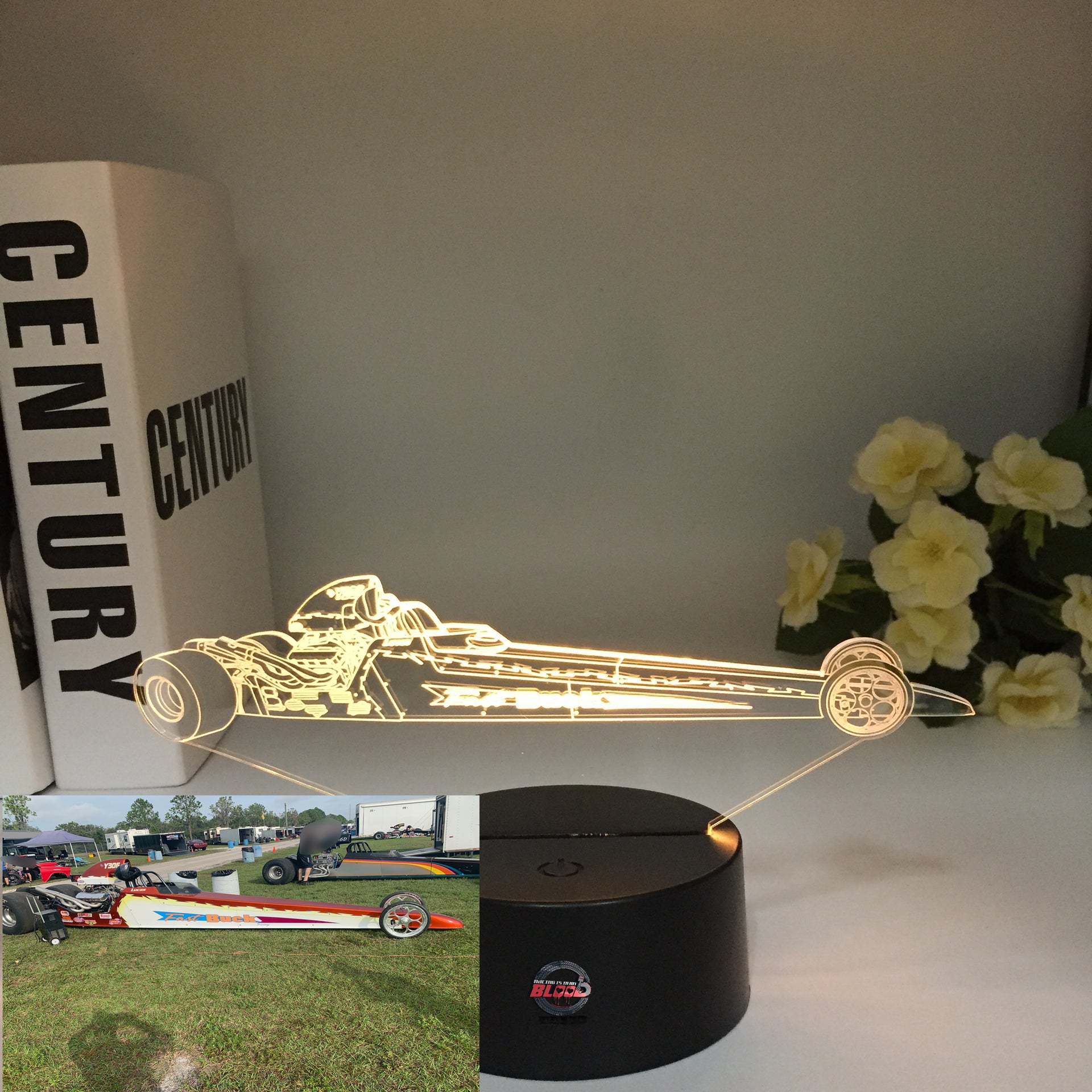 A personalized 3D LED Illusion Lamp featuring a custom-etched dragster design based on a user-provided photo, glowing in a vibrant blue on a black base.