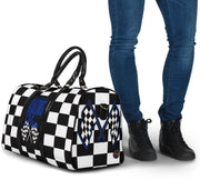 A stylish Racing Mom Travel Bag featuring a checkered flag pattern with the words "Racing Mom" and deep blue accents, carried by a model.
