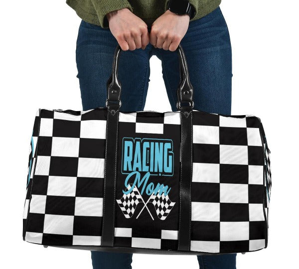 A stylish Racing Mom Travel Bag featuring a checkered flag pattern with the words "Racing Mom" and light blue accents, carried by a model.