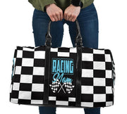A stylish Racing Mom Travel Bag featuring a checkered flag pattern with the words "Racing Mom" and light blue accents, carried by a model.