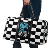 A stylish Racing Mom Travel Bag featuring a checkered flag pattern with the words "Racing Mom" and light blue accents, carried by a model.