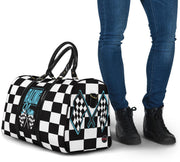 A stylish Racing Mom Travel Bag featuring a checkered flag pattern with the words "Racing Mom" and light blue accents, carried by a model.