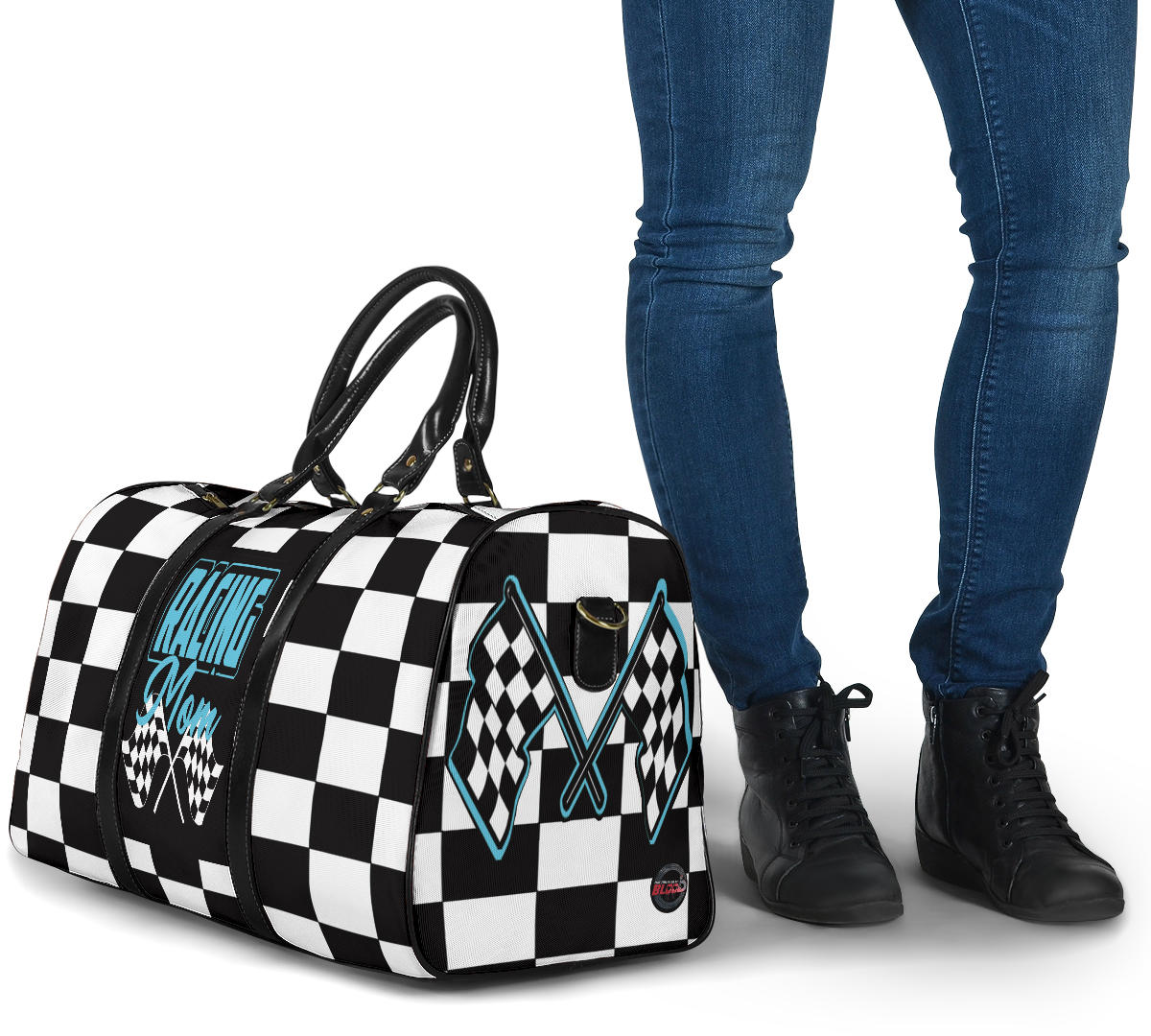 A stylish Racing Mom Travel Bag featuring a checkered flag pattern with the words "Racing Mom" and light blue accents, carried by a model.