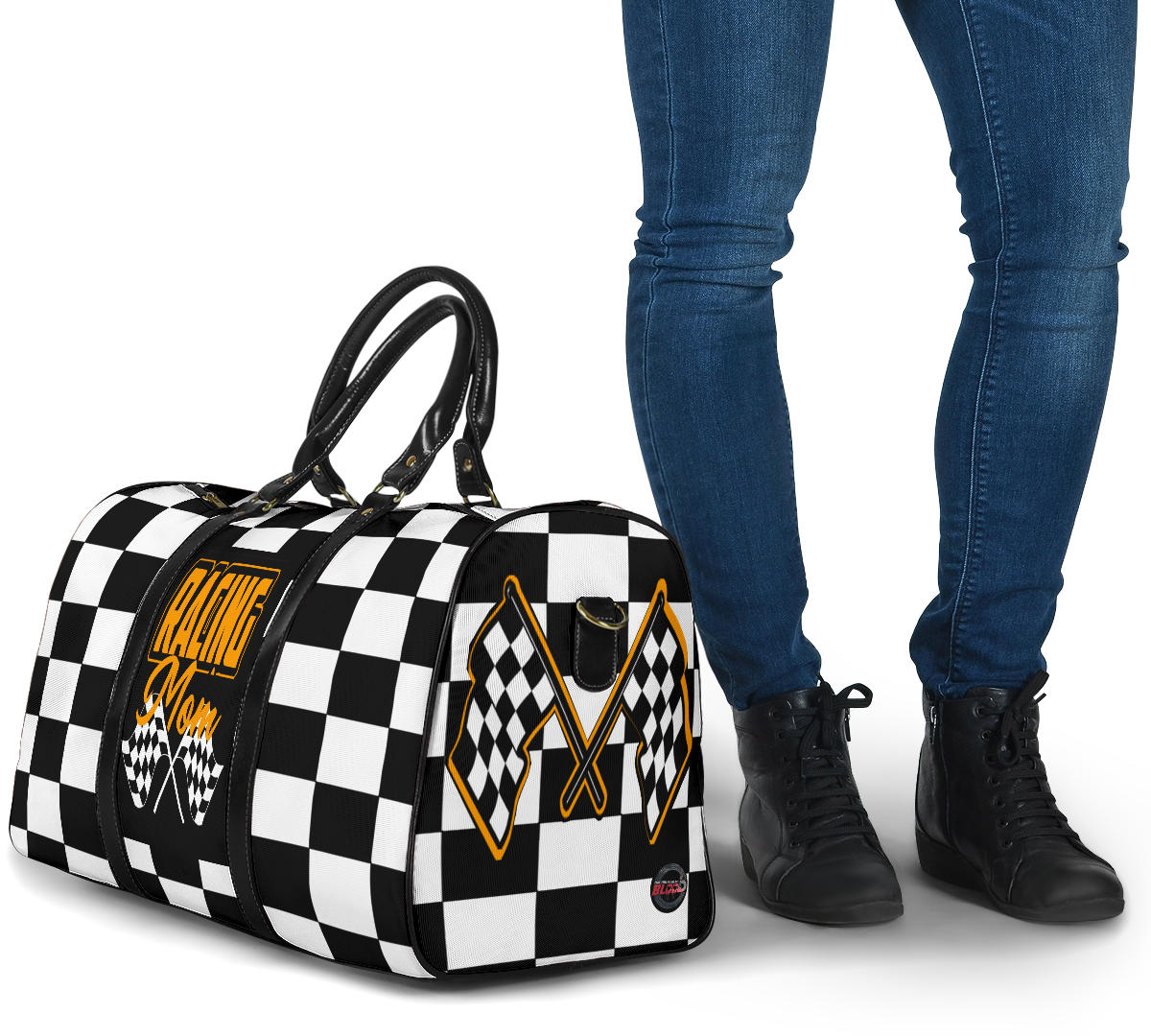A stylish Racing Mom Travel Bag featuring a checkered flag pattern with the words "Racing Mom" and vibrant orange accents, carried by a model.