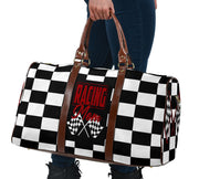 A stylish Racing Mom Travel Bag featuring a checkered flag pattern with the words "Racing Mom" and vibrant red accents, carried by a model.