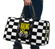A stylish Racing Mom Travel Bag featuring a checkered flag pattern with the words "Racing Mom" and vibrant yellow accents, carried by a model.