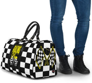 A stylish Racing Mom Travel Bag featuring a checkered flag pattern with the words "Racing Mom" and vibrant yellow accents, carried by a model.