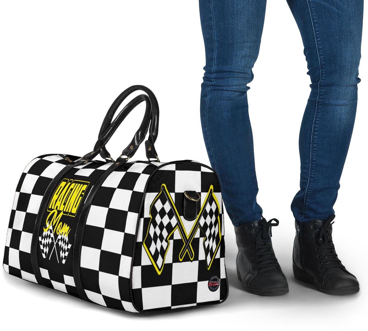 A stylish Racing Mom Travel Bag featuring a checkered flag pattern with the words "Racing Mom" and vibrant yellow accents, carried by a model.