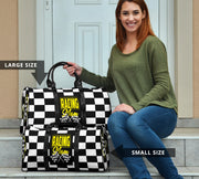 A stylish Racing Mom Travel Bag featuring a checkered flag pattern with the words "Racing Mom" and vibrant yellow accents, carried by a model.