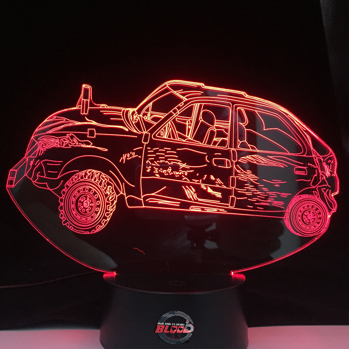Demolition Derby Car 3D LED Lamp featuring a detailed full-size derby sedan silhouette glowing in a vibrant orange on a premium black base.