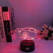 Drag Racing Chevy Monza 3D LED Illusion Lamp showing the aggressive racing silhouette in a vibrant purple glow on a premium black base.