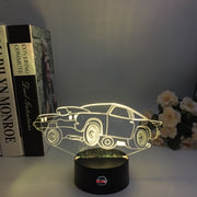 Drag Racing Chevy Monza 3D LED Illusion Lamp showing the aggressive racing silhouette in a vibrant purple glow on a premium black base.