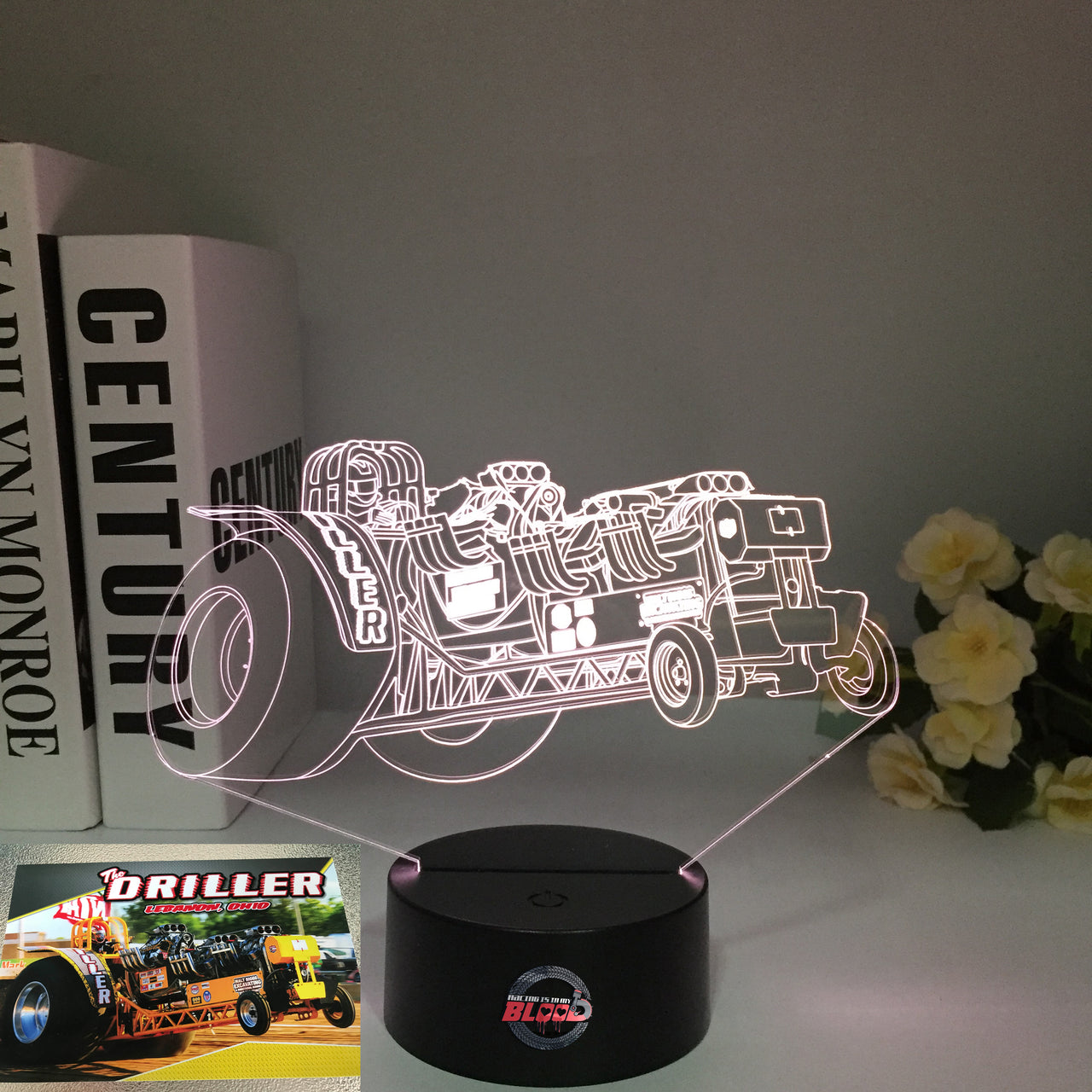 Dragster "The Driller" 3D LED Illusion Lamp showing a professional top fuel dragster silhouette in a vibrant green glow on a premium black base.