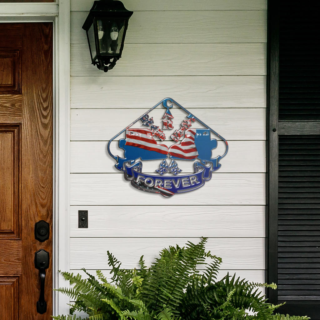 Dwarf Car Racing Forever metal sign on white porch siding beside a wooden door and fern.