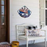 Dwarf Car Racing USA metal sign displayed above a white porch bench with decorative pillows.