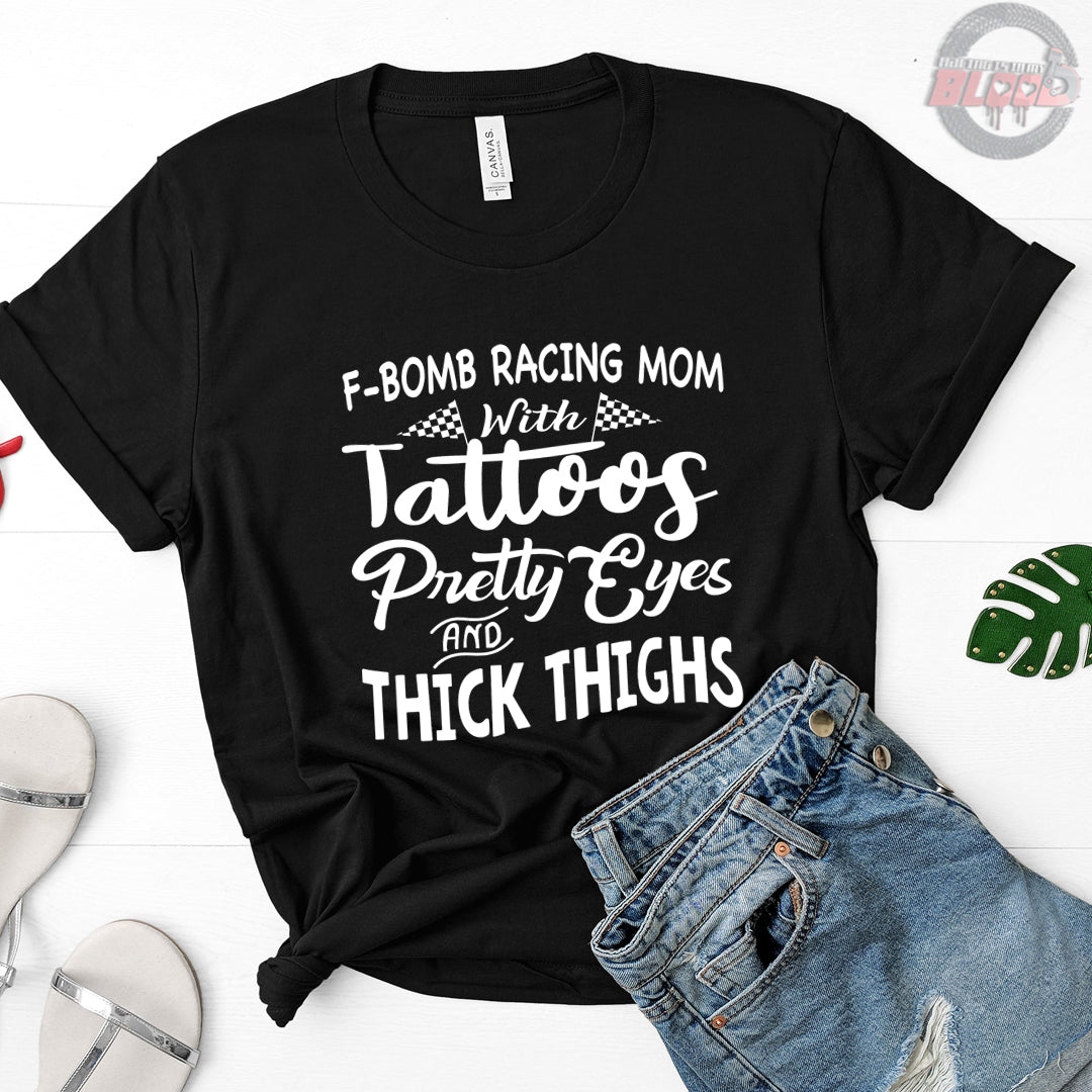 F-Bomb Racing Mom apparel collection featuring bold "Tattoos Pretty Eyes And Thick Thighs" designs on women's v-necks, racerback tanks, and cozy fleece hoodies.