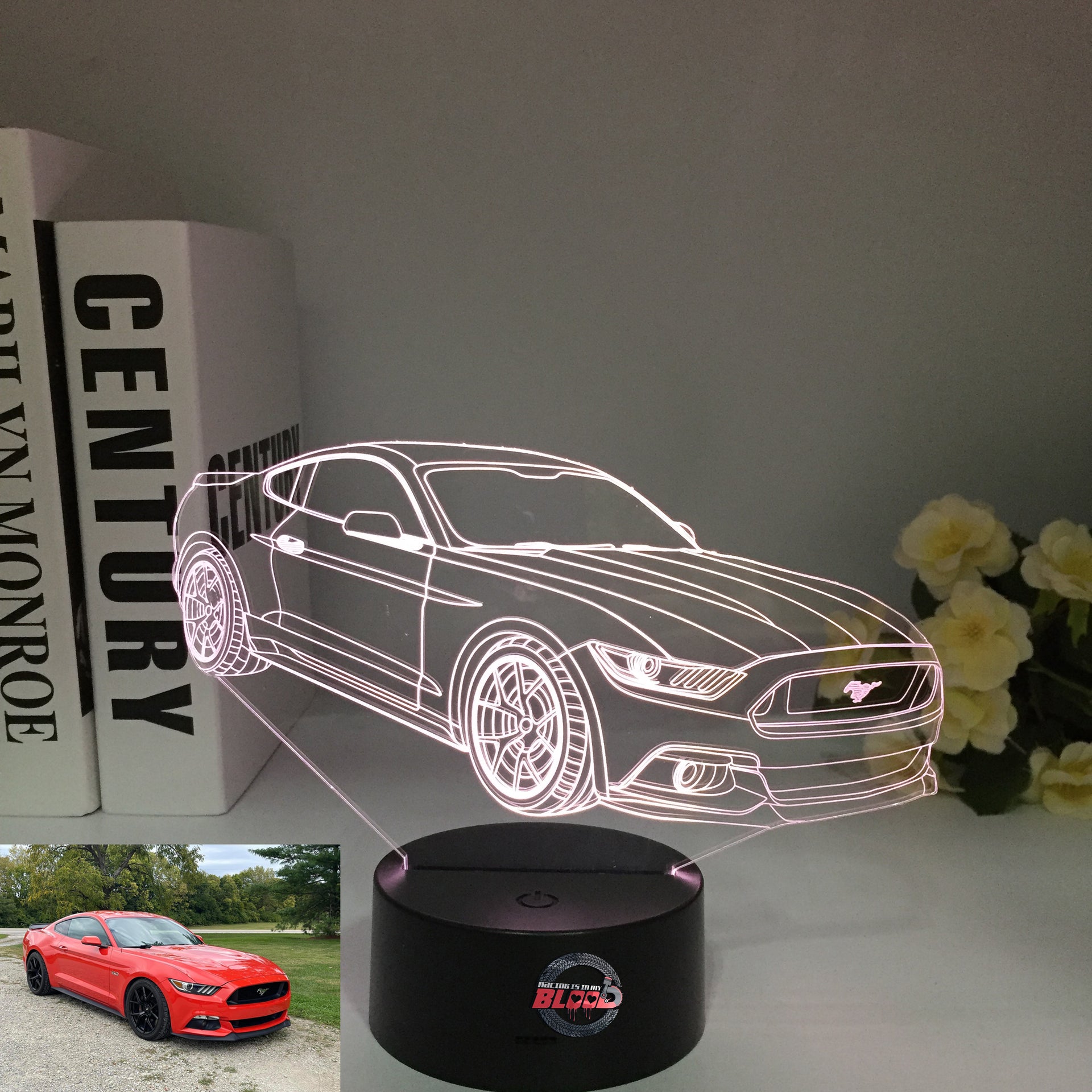 Ford Mustang 3D LED Illusion Lamp showing the iconic car silhouette in vibrant blue light on a black base.