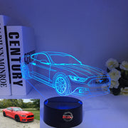 Ford Mustang 3D LED Illusion Lamp showing the iconic car silhouette in vibrant blue light on a black base.