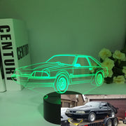 Ford Mustang LX 3D LED Illusion Lamp showing the classic Fox Body silhouette in a vibrant blue glow on a premium black base.