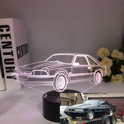 Ford Mustang LX 3D LED Illusion Lamp showing the classic Fox Body silhouette in a vibrant blue glow on a premium black base.