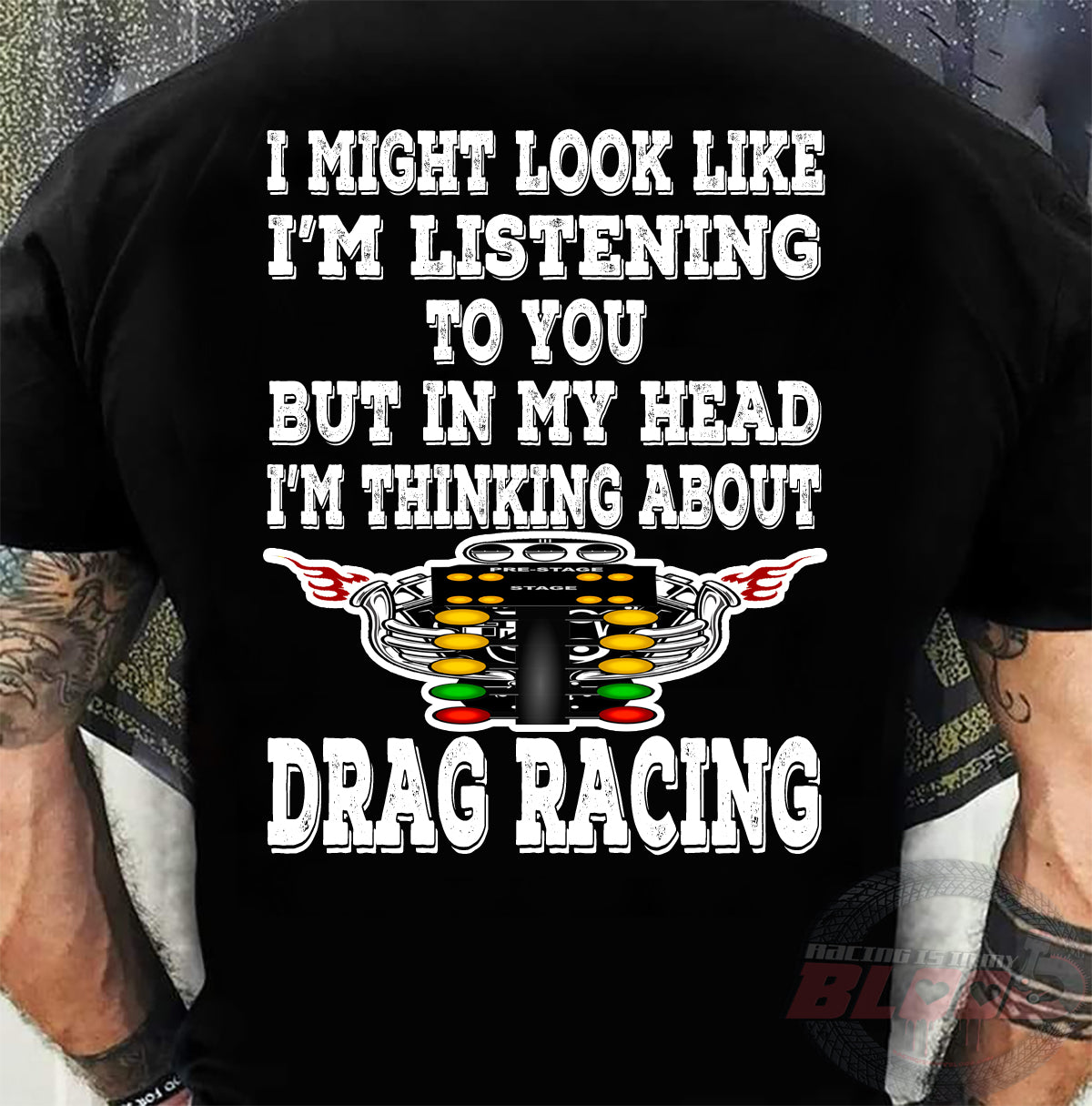 Funny drag racing apparel featuring the quote "I Might Look Like I'm Listening To You", available in premium slim-fit tees, tanks, crewneck sweatshirts, and heavy-duty hoodies.