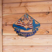 Go-Kart Forever USA metal sign with paired kart silhouettes and patriotic flag details displayed against natural wood planks.