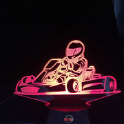 Go-Kart Racing 3D LED Lamp featuring a detailed racing kart silhouette glowing in a vibrant lime green on a premium black base.