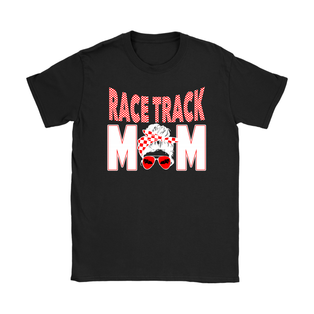 High-performance apparel mockup featuring a woman sitting on the grandstand bleachers at a dirt racing arena, wearing a premium black t-shirt with a sharp white and red "Race Track Mom" graphic showing a late model dirt car.
