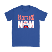 High-performance apparel mockup featuring a woman sitting on the grandstand bleachers at a dirt racing arena, wearing a premium black t-shirt with a sharp white and red "Race Track Mom" graphic showing a late model dirt car.