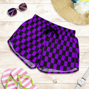 High-performance women's athletic shorts featuring a vibrant purple and black checkered pattern, designed with an elastic drawstring waist and functional side pockets.
