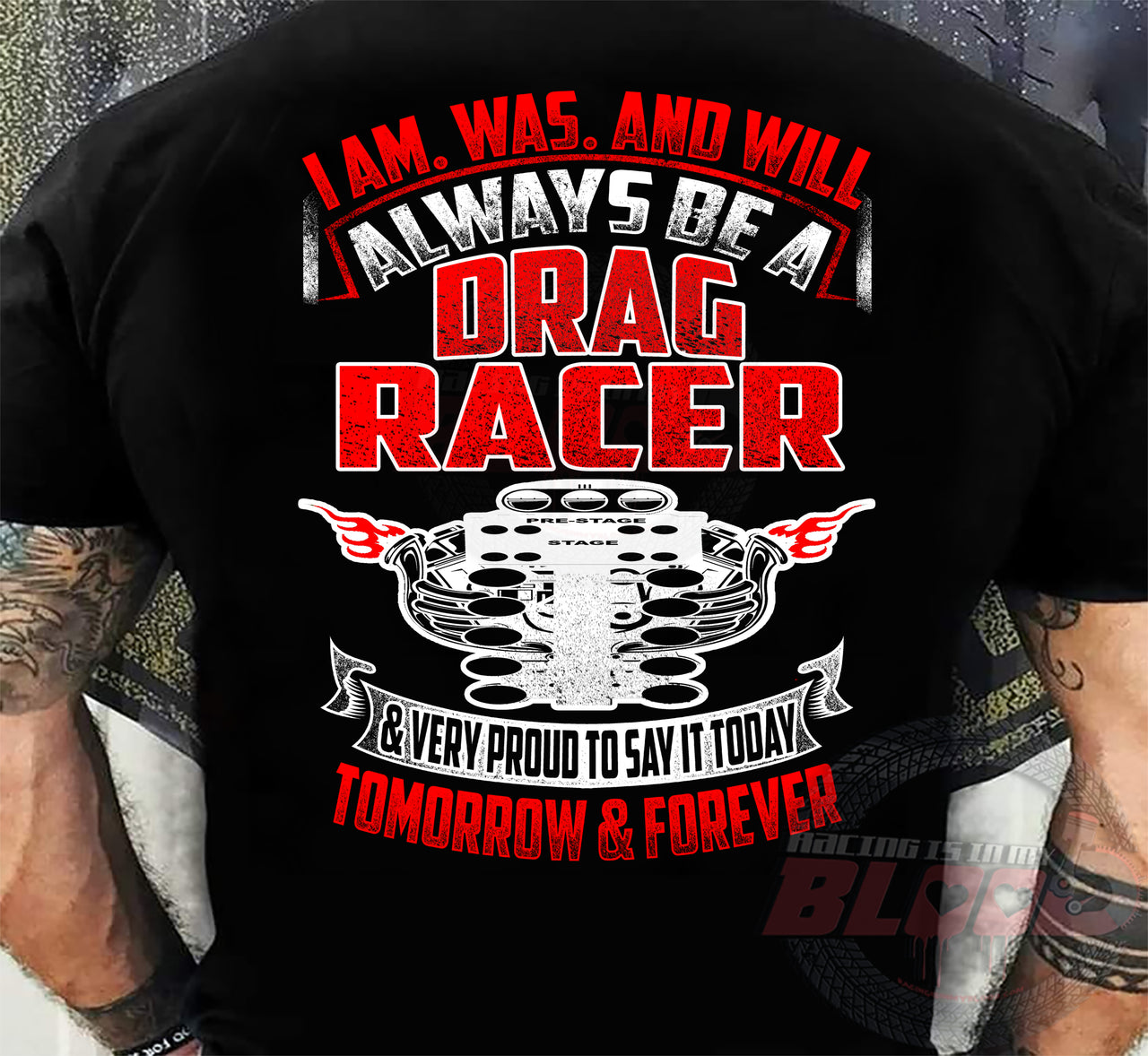 High-quality drag racing apparel featuring the bold statement "I Am, Was, And Will Always Be A Drag Racer" alongside a detailed graphic of a drag racing engine and staging tree, available in premium t-shirts and hoodies.