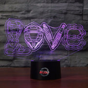 Love Motocross 3D LED Lamp showing a dirt bike rider jumping through a heart-shaped silhouette, glowing in a vibrant pink on a modern black base.