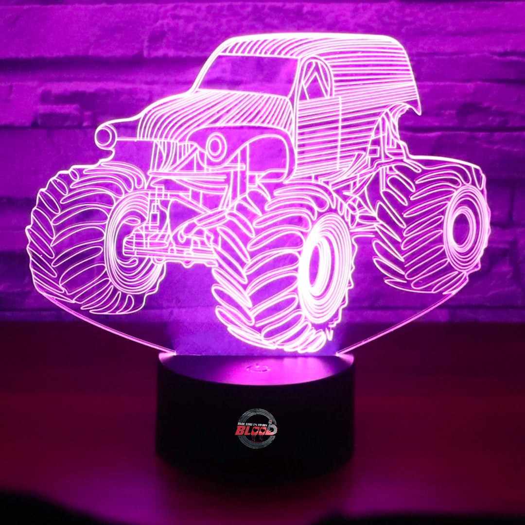 Monster Truck 3D LED Lamp showing a lifted truck silhouette with massive tires glowing in a vibrant, neon yellow on a black base.