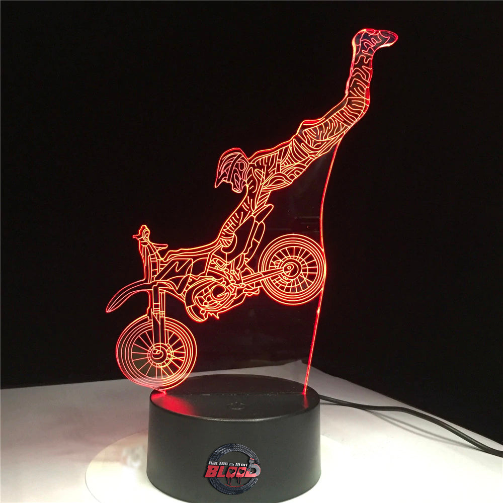Motocross 3D LED Lamp New showing a rider mid-air on a dirt bike, glowing in a vibrant blue on a modern black base.