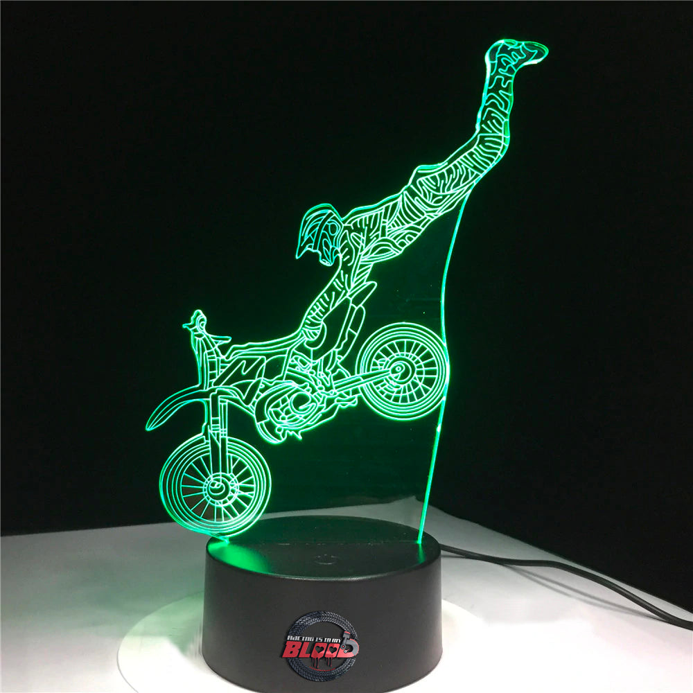 Motocross 3D LED Lamp New showing a rider mid-air on a dirt bike, glowing in a vibrant blue on a modern black base.
