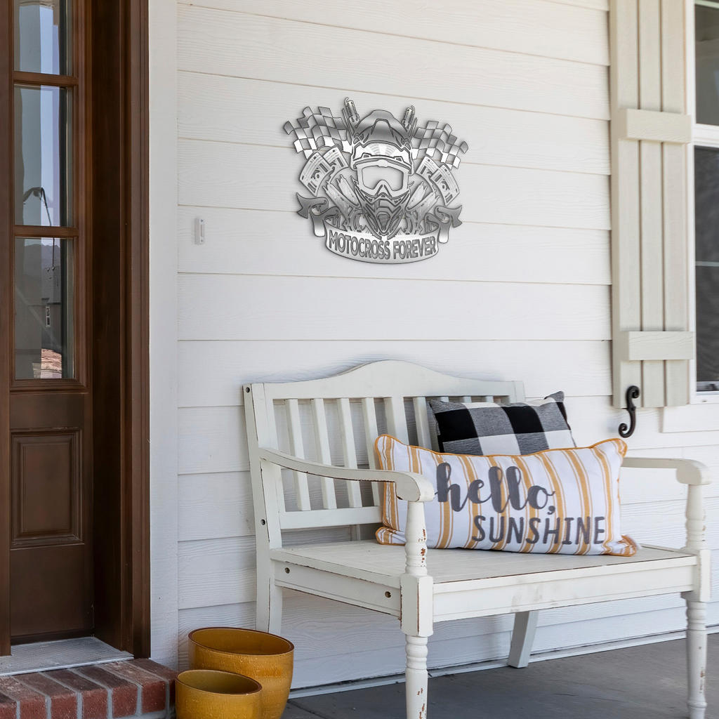 Motocross Forever metal sign displayed above a white porch bench with decorative pillows.