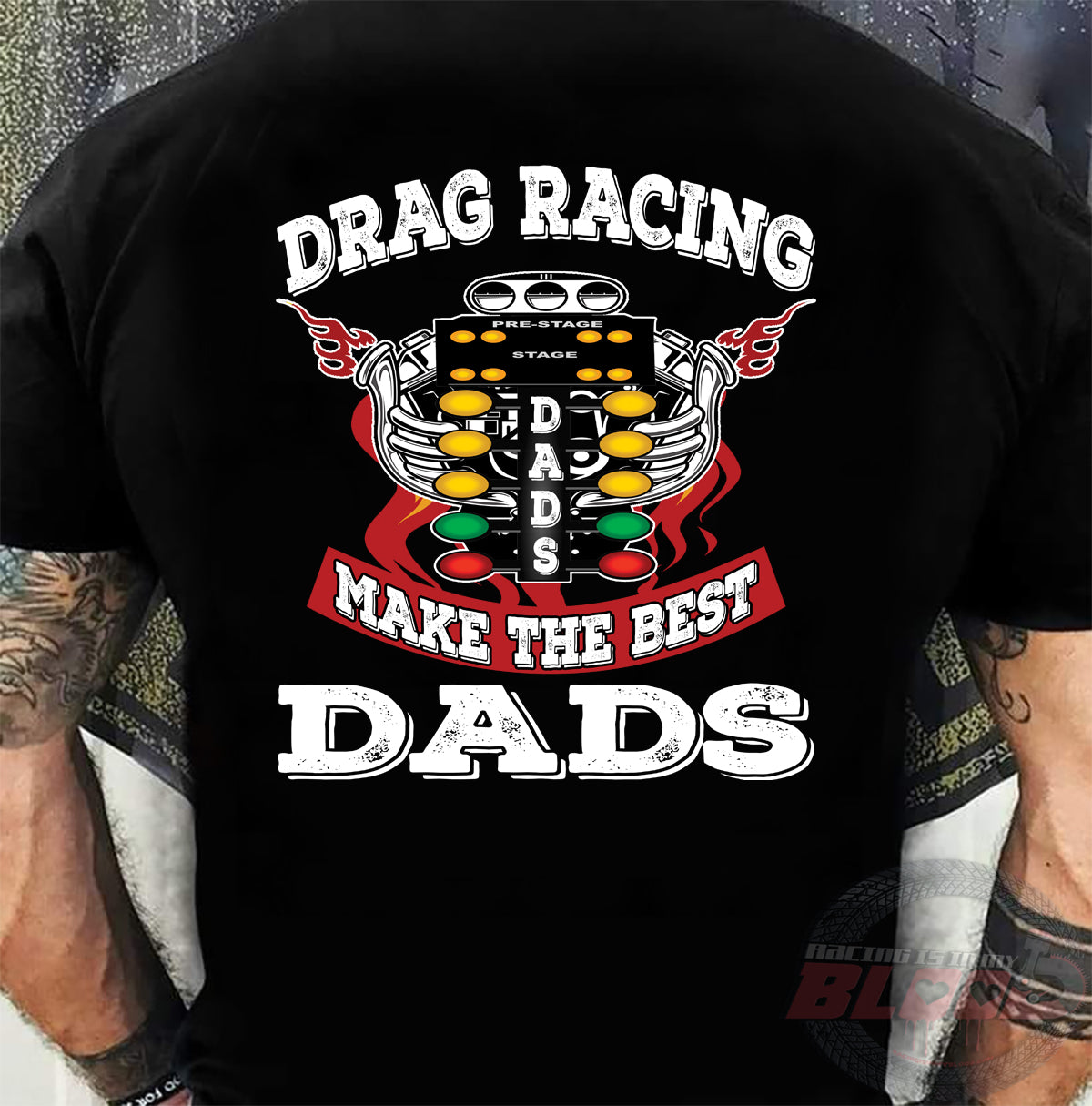 Motorsports apparel featuring the quote "Drag Racing Dads Make The Best Dads," available in premium tees, triblends, and hoodies for the father who loves the track.