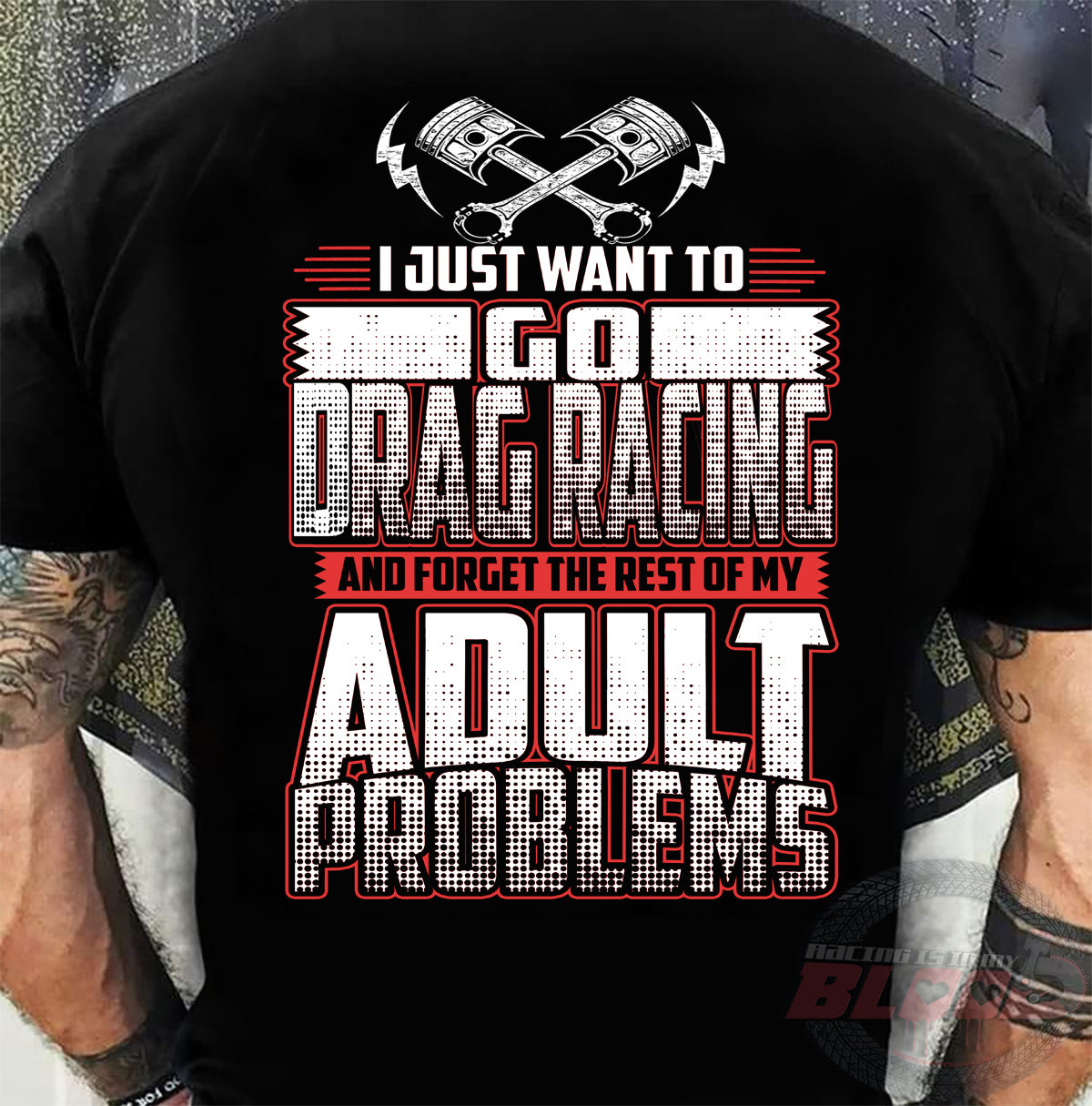 Motorsports t-shirt with the phrase "I Just Want To Go Drag Racing And Forget The Rest Of My Adult Problems," available in multiple styles including slim-fit cotton and fleece hoodies.