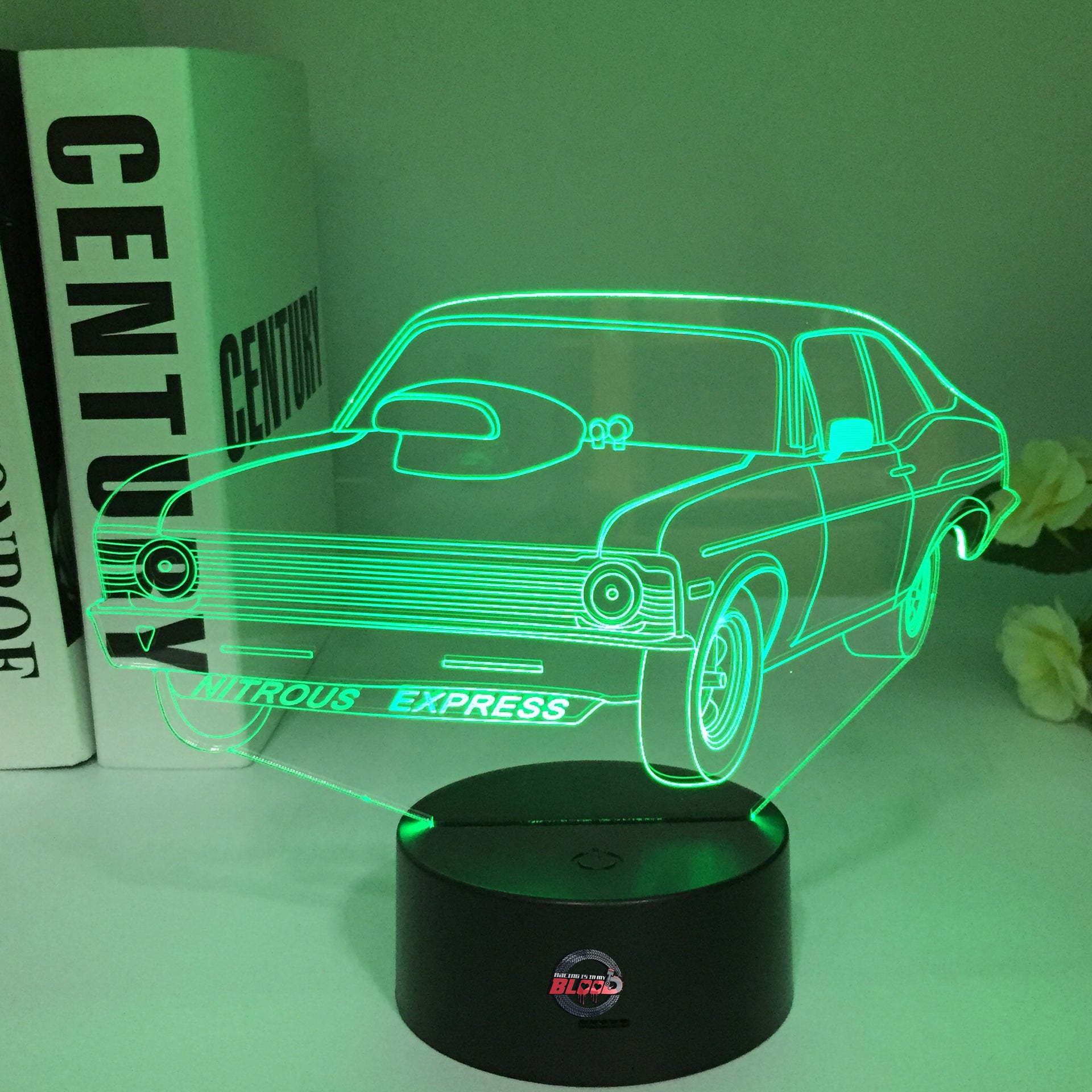 Nova Express Nitrous 3D LED Illusion Lamp showing an aggressive drag racing Chevy Nova silhouette in a vibrant blue glow on a premium black base.