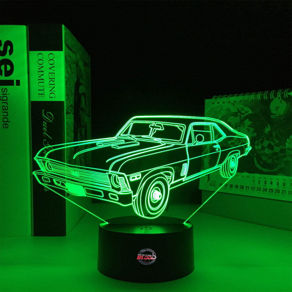 Personalized 1969 Chevy Nova LED Lamp featuring a custom name and number on a glowing muscle car silhouette, shown in a vibrant orange on a black base.