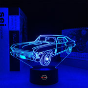 Personalized 1969 Chevy Nova LED Lamp featuring a custom name and number on a glowing muscle car silhouette, shown in a vibrant orange on a black base.