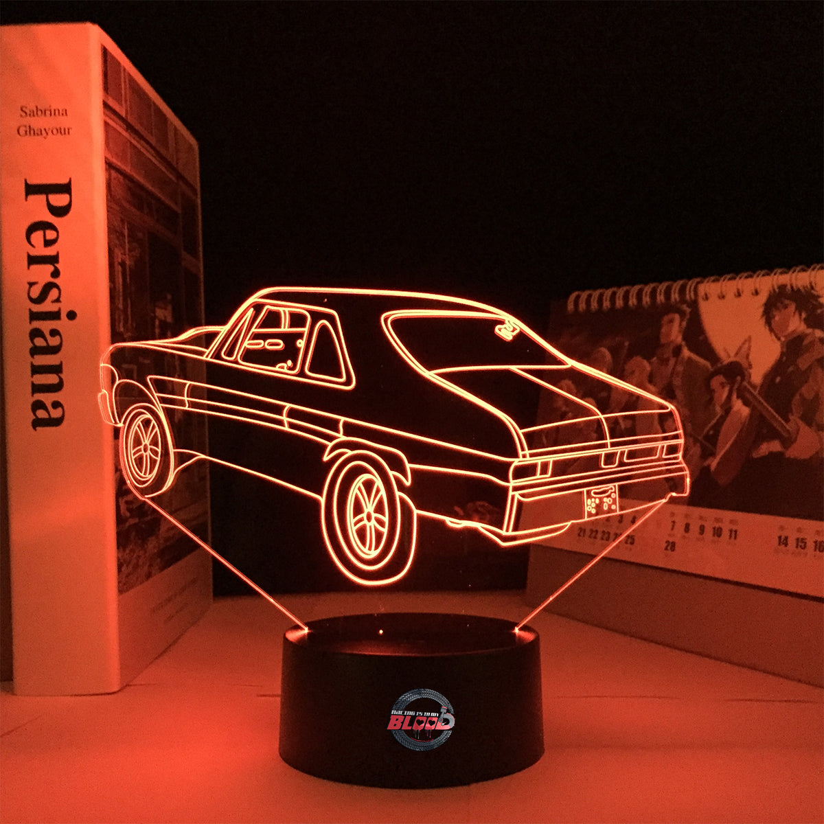 Personalized 1969 Chevy Nova LED Lamp featuring a custom name on a glowing muscle car silhouette, shown in a vibrant red on a black base.