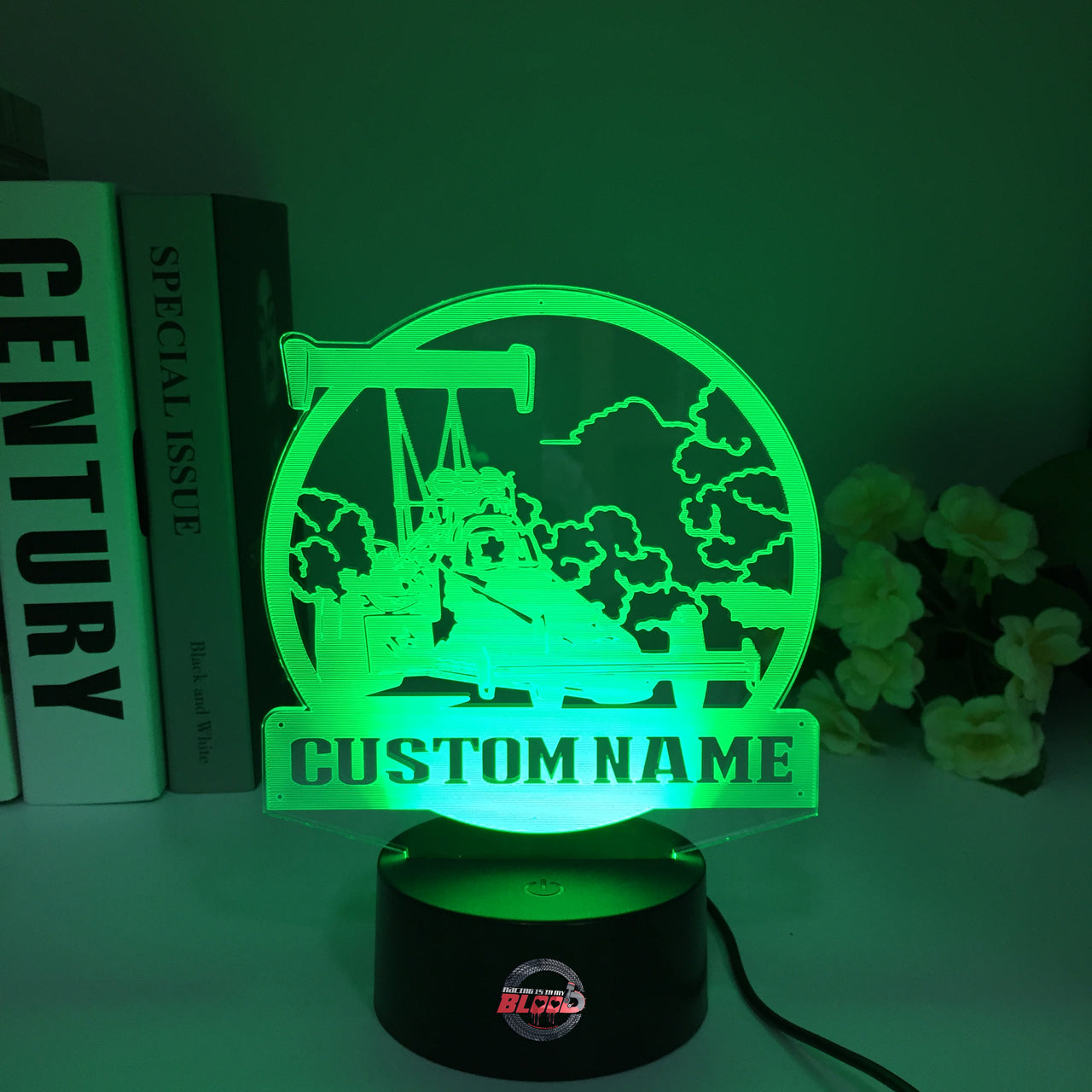 Personalized Dragster 3D LED Illusion Lamp featuring a custom name and racing number alongside a sleek dragster silhouette, glowing in a vibrant electric blue on a black base.