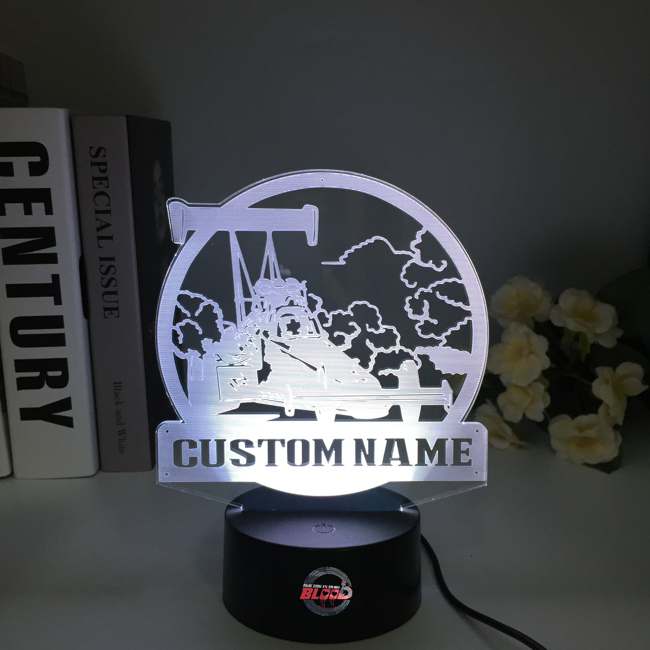 Personalized Dragster 3D LED Illusion Lamp featuring a custom name and racing number alongside a sleek dragster silhouette, glowing in a vibrant electric blue on a black base.