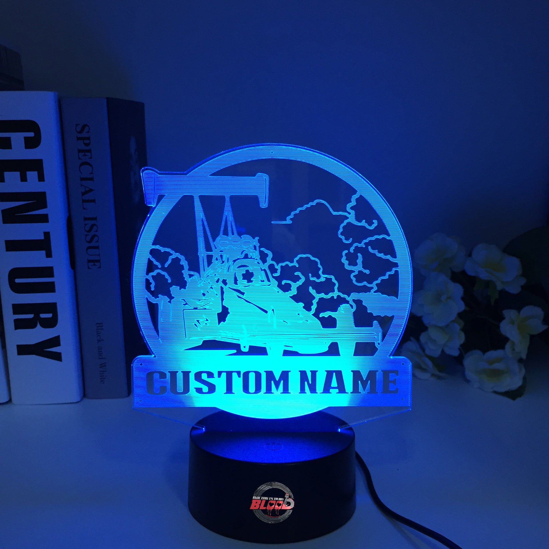 Personalized Dragster 3D LED Illusion Lamp featuring a custom name and racing number alongside a sleek dragster silhouette, glowing in a vibrant electric blue on a black base.