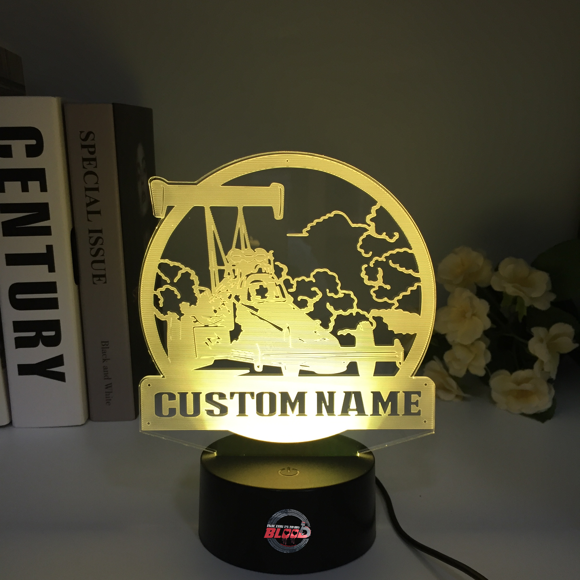 Personalized Dragster 3D LED Illusion Lamp featuring a custom name and racing number alongside a sleek dragster silhouette, glowing in a vibrant electric blue on a black base.