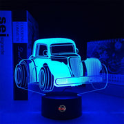 Personalized Legend Car LED Lamp featuring a custom name and racing number alongside a classic legend car silhouette, glowing in a vibrant electric blue on a black base.