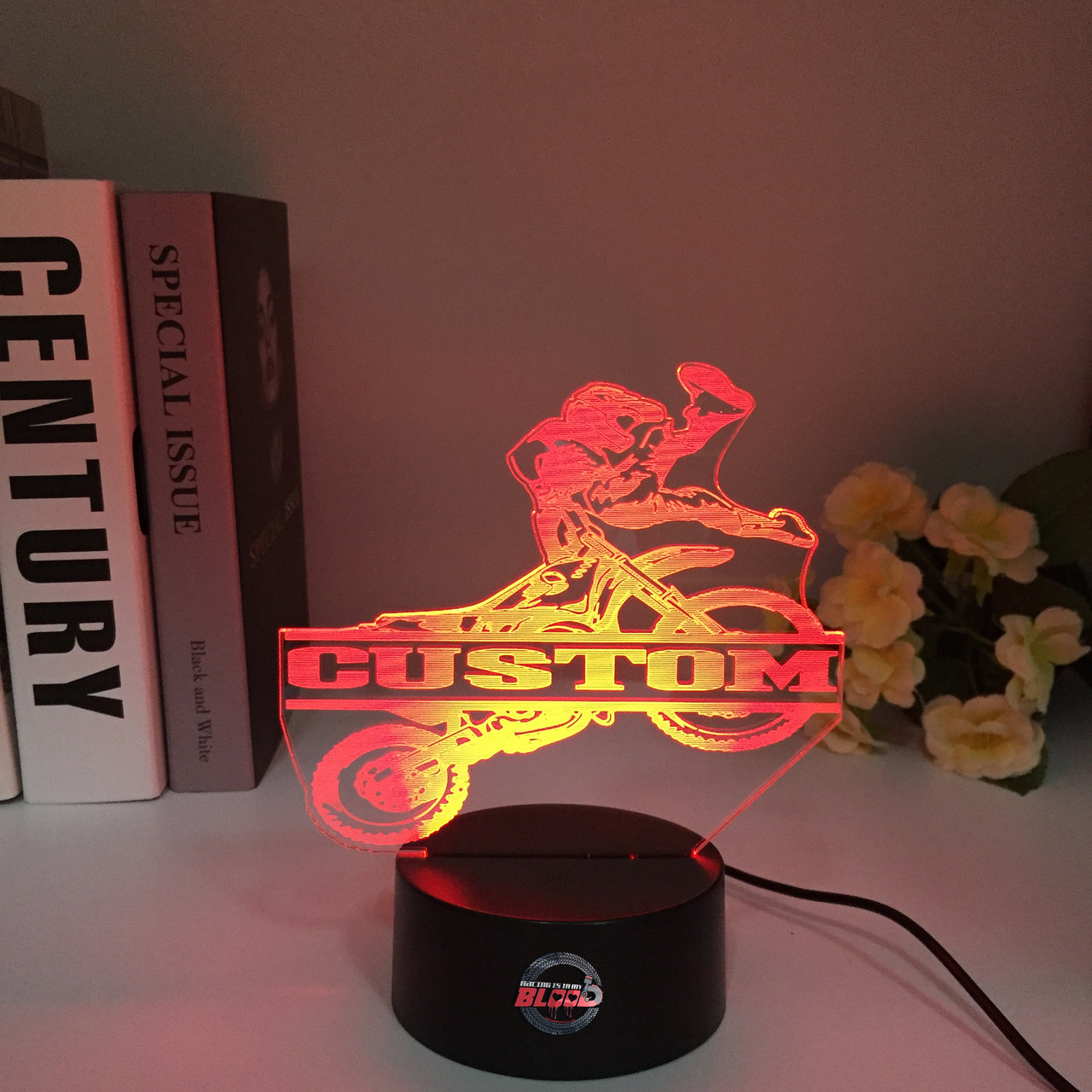 Personalized Motocross 3D LED Illusion Lamp featuring a custom name and racing number alongside a dirt bike rider silhouette, glowing in a vibrant orange on a black base.